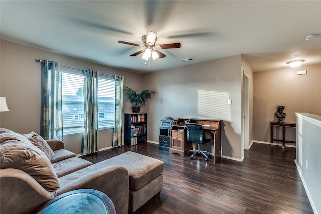 living room featuring a textured ceiling, dark wood-type flooring, and ceiling fan