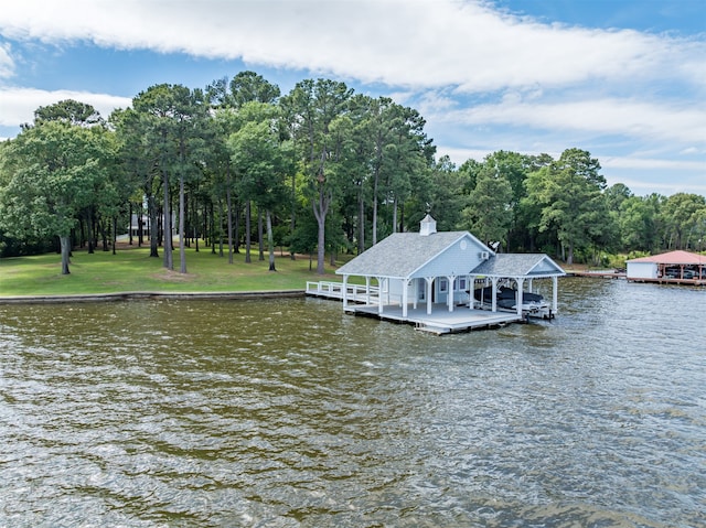 dock area featuring a yard and a water view