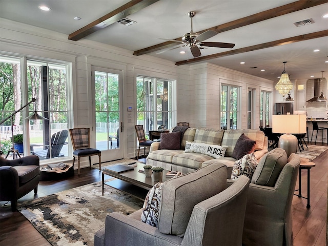 living room with beamed ceiling, dark hardwood / wood-style flooring, and ceiling fan