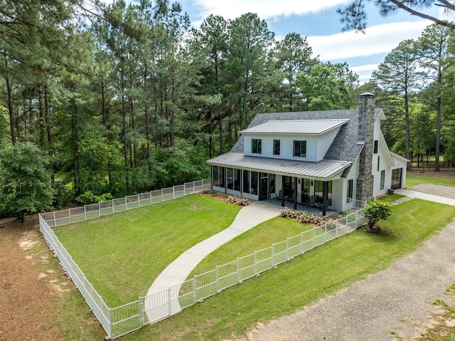 farmhouse inspired home with a front yard