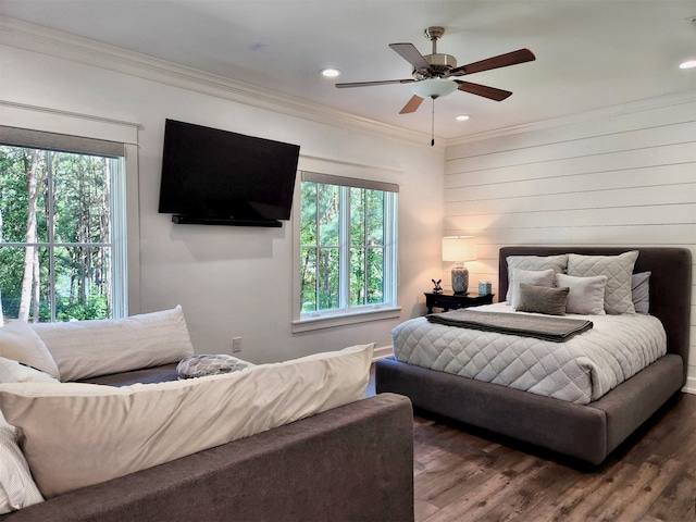 bedroom featuring crown molding, ceiling fan, and dark hardwood / wood-style floors