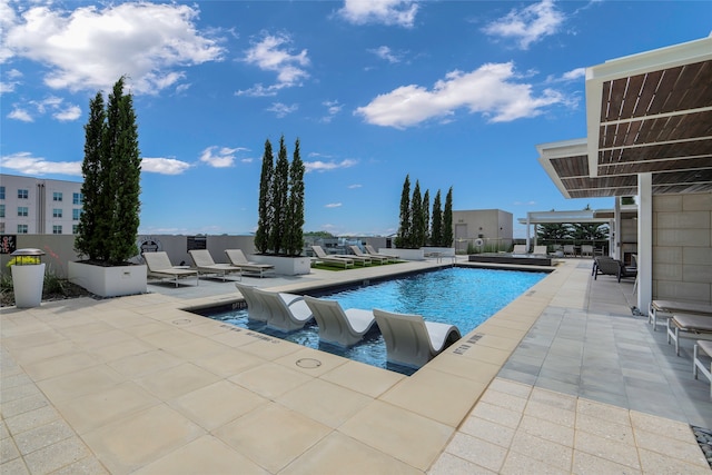 view of swimming pool featuring a patio