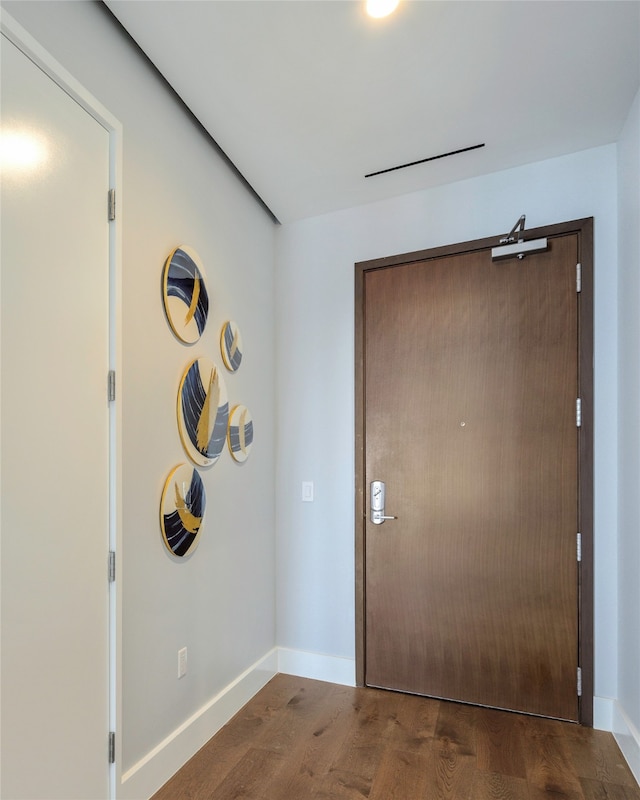 foyer with wood-type flooring