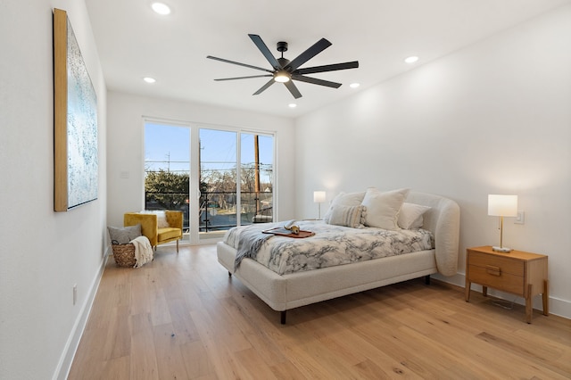 bedroom with ceiling fan, access to outside, and wood-type flooring