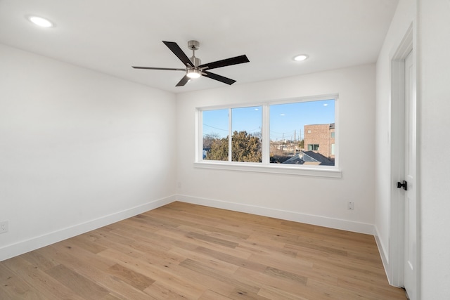 unfurnished room featuring ceiling fan and light wood-type flooring