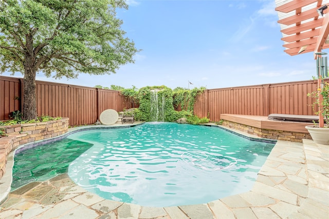 view of pool featuring a hot tub and pool water feature