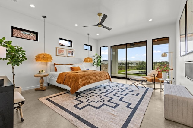 bedroom featuring concrete floors, ceiling fan, and access to exterior