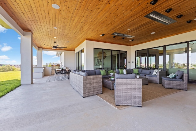 view of terrace featuring ceiling fan and an outdoor living space