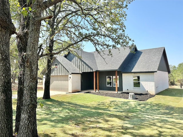 view of front facade with a garage and a front lawn