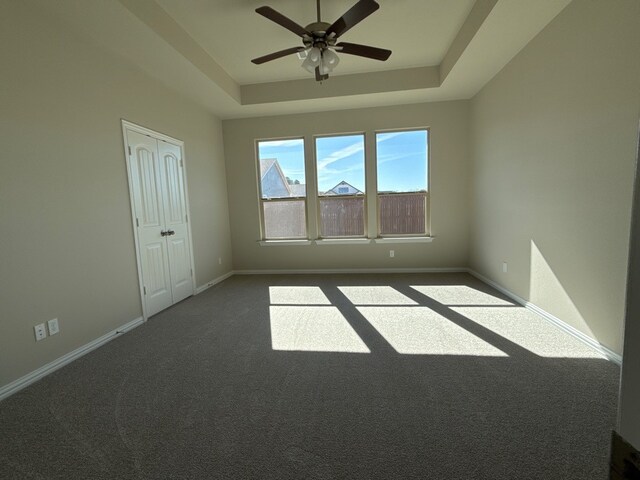 interior space with dark hardwood / wood-style floors and ceiling fan