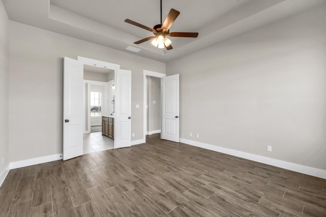 unfurnished bedroom featuring ceiling fan and wood-type flooring