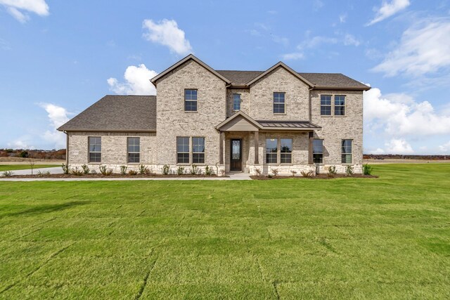 view of front of home with a front lawn