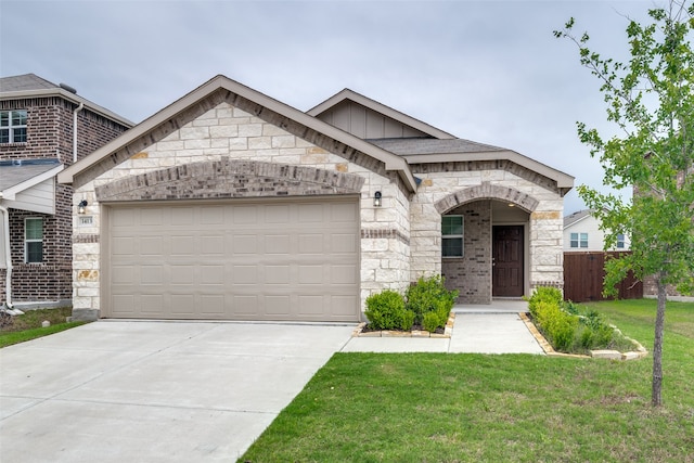 view of front of property with a garage and a front lawn