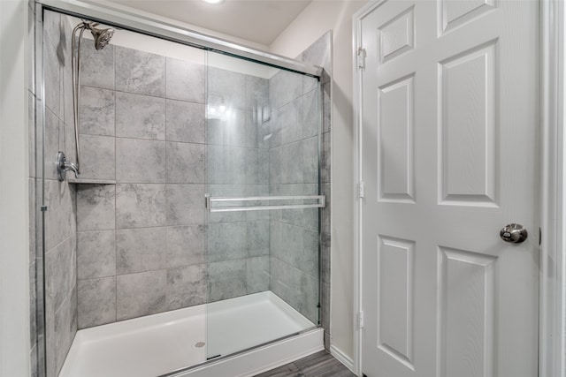 bathroom featuring an enclosed shower