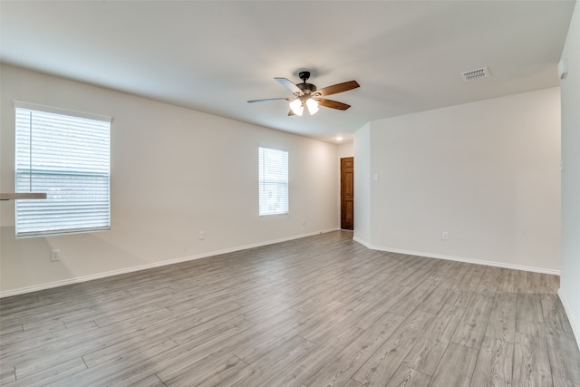 unfurnished room with light hardwood / wood-style flooring and ceiling fan