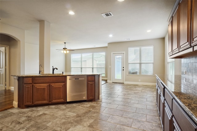 kitchen featuring a kitchen island, ceiling fan, sink, light tile floors, and stainless steel dishwasher