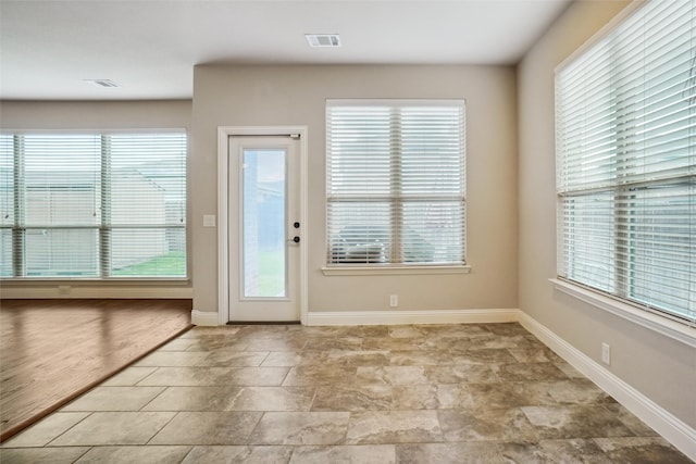 doorway with tile flooring