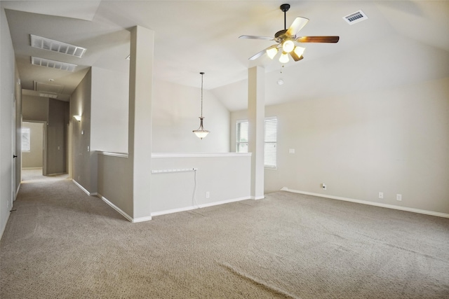 carpeted empty room featuring ceiling fan and vaulted ceiling