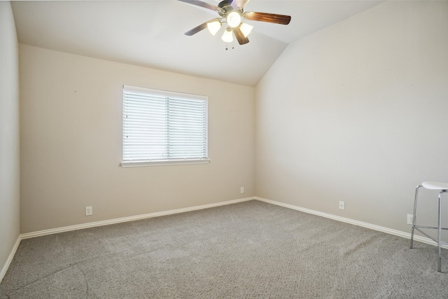 spare room with ceiling fan, carpet floors, and lofted ceiling