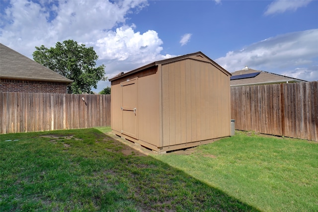 view of shed / structure with a lawn