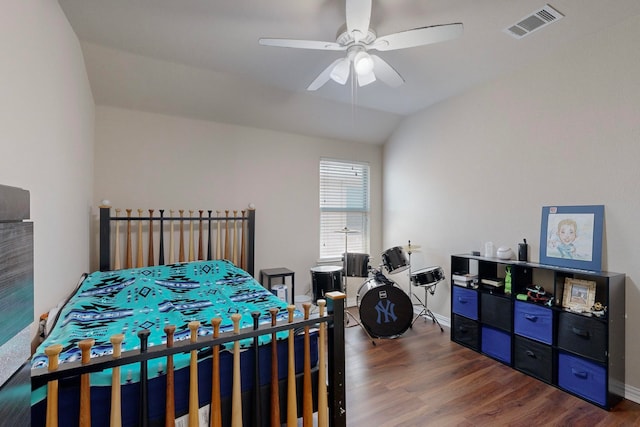 bedroom with lofted ceiling, ceiling fan, and dark wood-type flooring