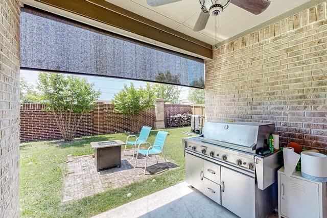 view of patio featuring ceiling fan, a grill, and an outdoor fire pit