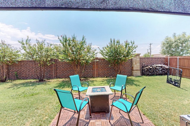 view of patio with a fire pit