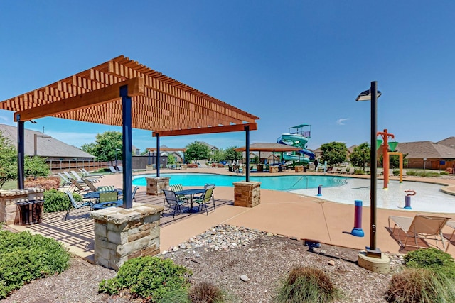 view of swimming pool featuring a pergola and a patio