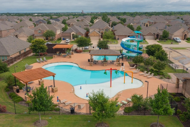 view of pool featuring a patio and a water slide