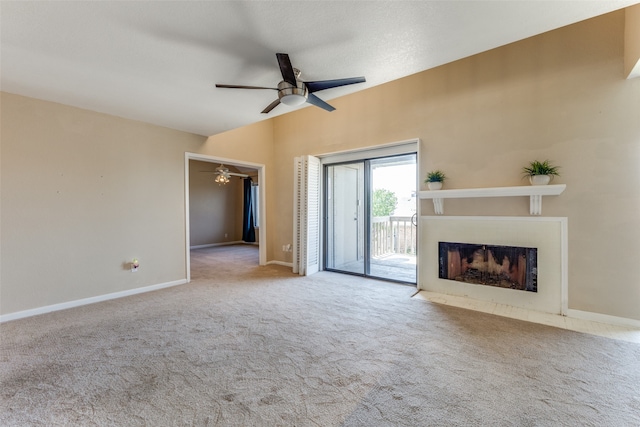 unfurnished living room with ceiling fan, light carpet, and vaulted ceiling