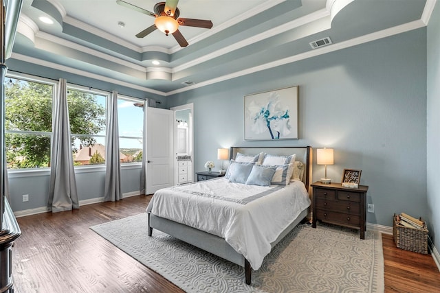 bedroom featuring ensuite bath, ceiling fan, crown molding, and dark hardwood / wood-style flooring