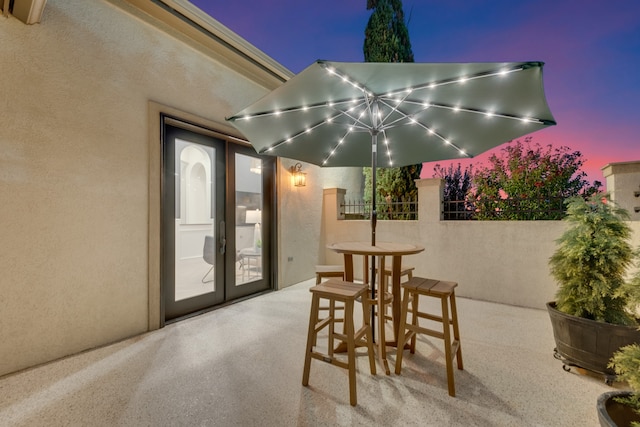 view of patio terrace at dusk