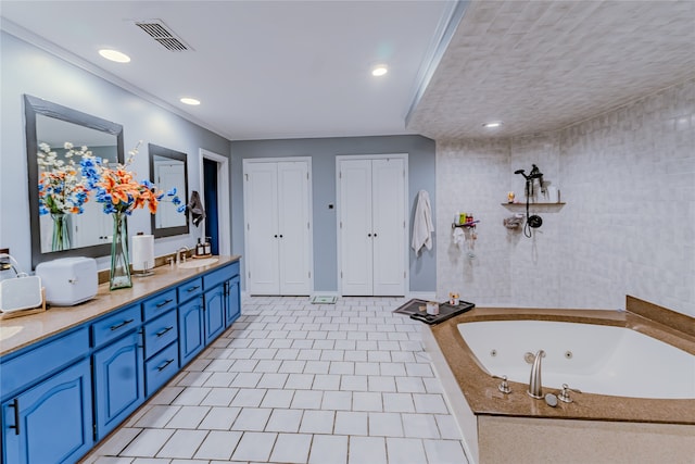 bathroom with tile flooring, double sink vanity, ornamental molding, and a textured ceiling