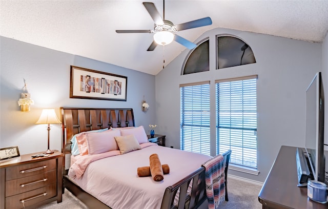 carpeted bedroom with multiple windows, ceiling fan, and lofted ceiling