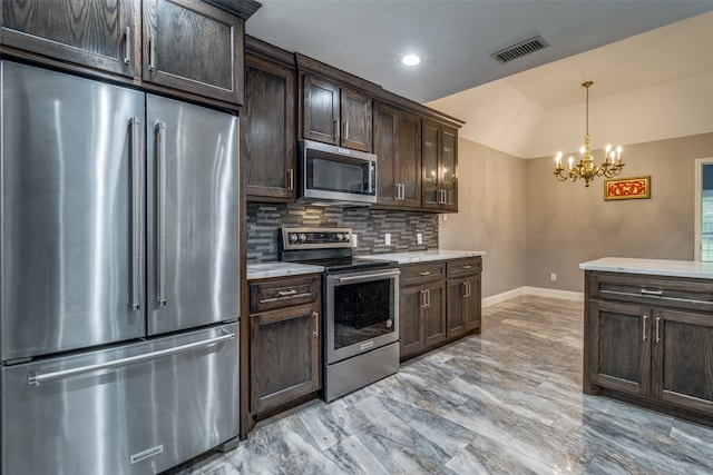 kitchen with a notable chandelier, tasteful backsplash, dark brown cabinets, appliances with stainless steel finishes, and light tile floors