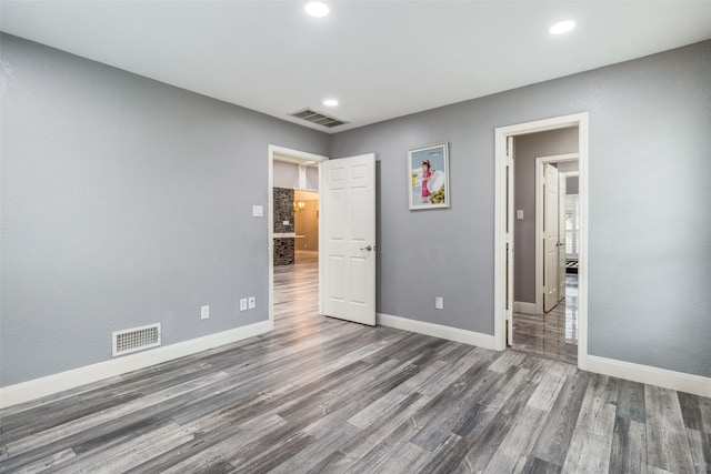 unfurnished bedroom featuring hardwood / wood-style floors