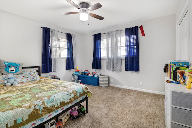 bedroom featuring a closet, ceiling fan, and carpet flooring