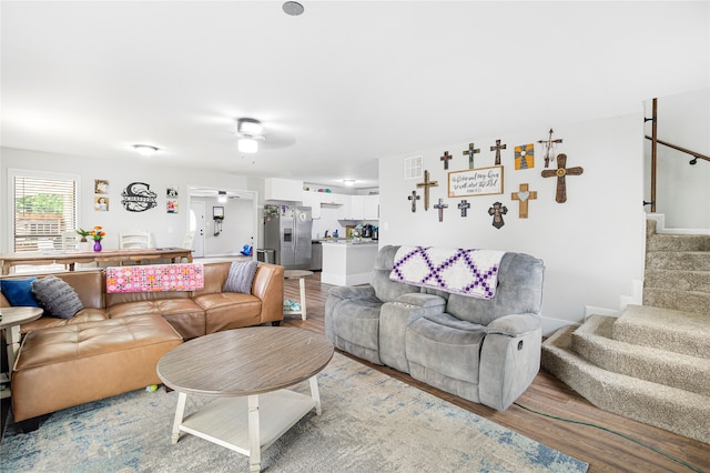 living room with ceiling fan and hardwood / wood-style floors