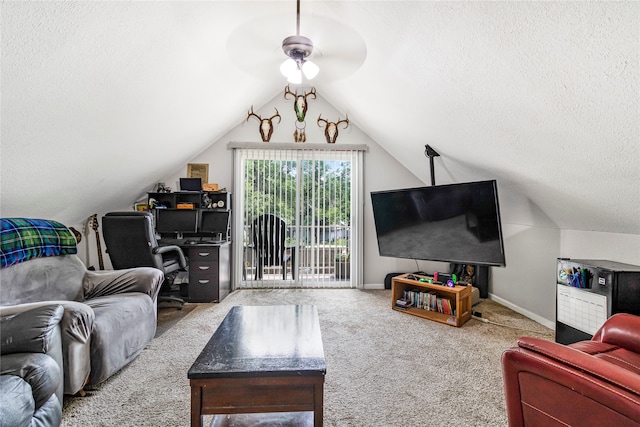 carpeted living room with lofted ceiling, ceiling fan, and a textured ceiling