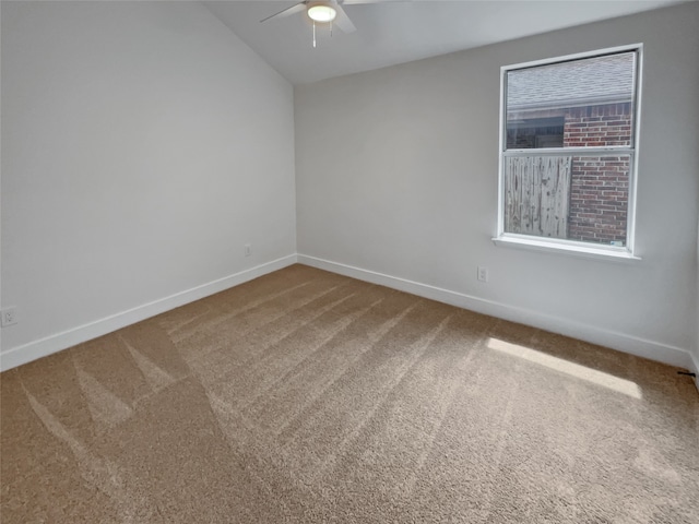 empty room featuring carpet flooring and ceiling fan