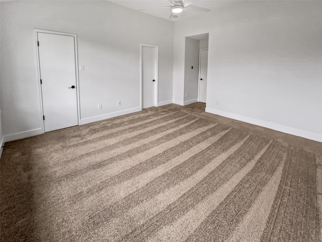 spare room with carpet flooring and ceiling fan