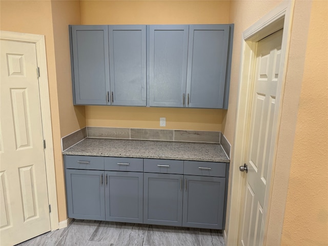 kitchen with light stone countertops