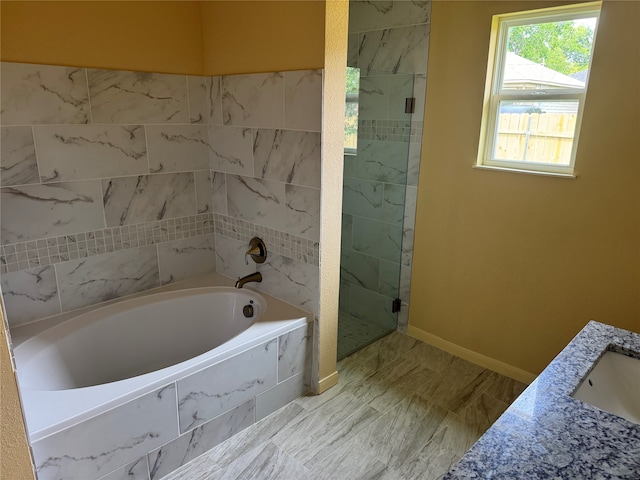 bathroom featuring vanity and plus walk in shower