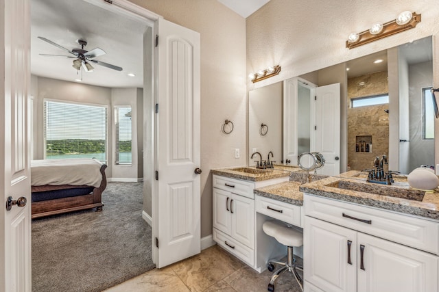 bathroom featuring a wealth of natural light, dual vanity, tile flooring, and ceiling fan