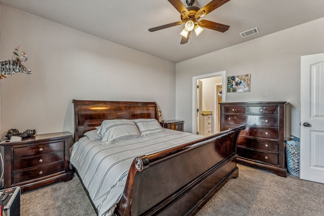 carpeted bedroom featuring ensuite bathroom and ceiling fan