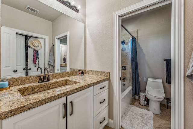 full bathroom featuring tile floors, shower / bath combo with shower curtain, toilet, and vanity