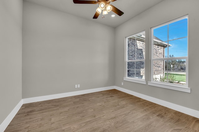 spare room with ceiling fan and light hardwood / wood-style floors