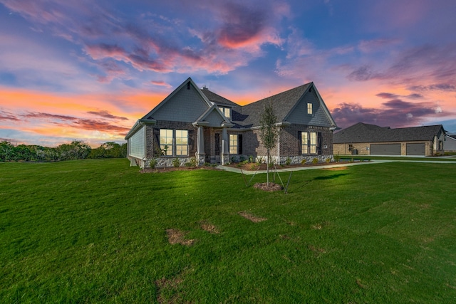 view of front of property with a yard