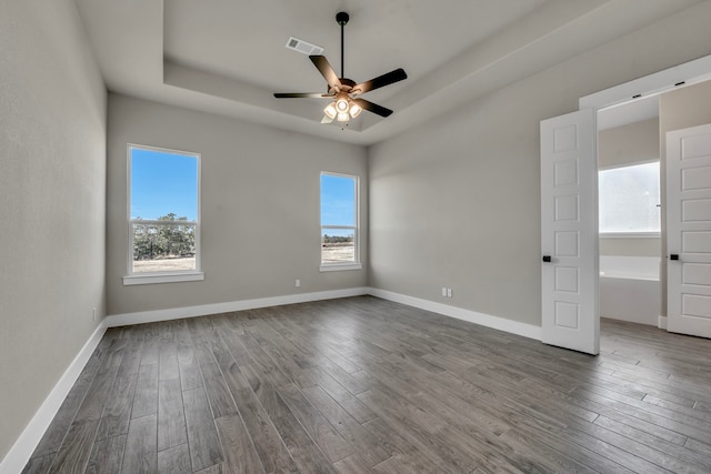 unfurnished room with hardwood / wood-style flooring and ceiling fan