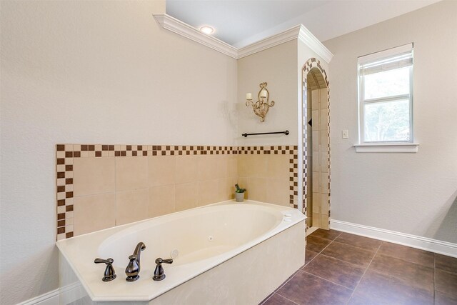 bathroom with a bathing tub and tile patterned floors